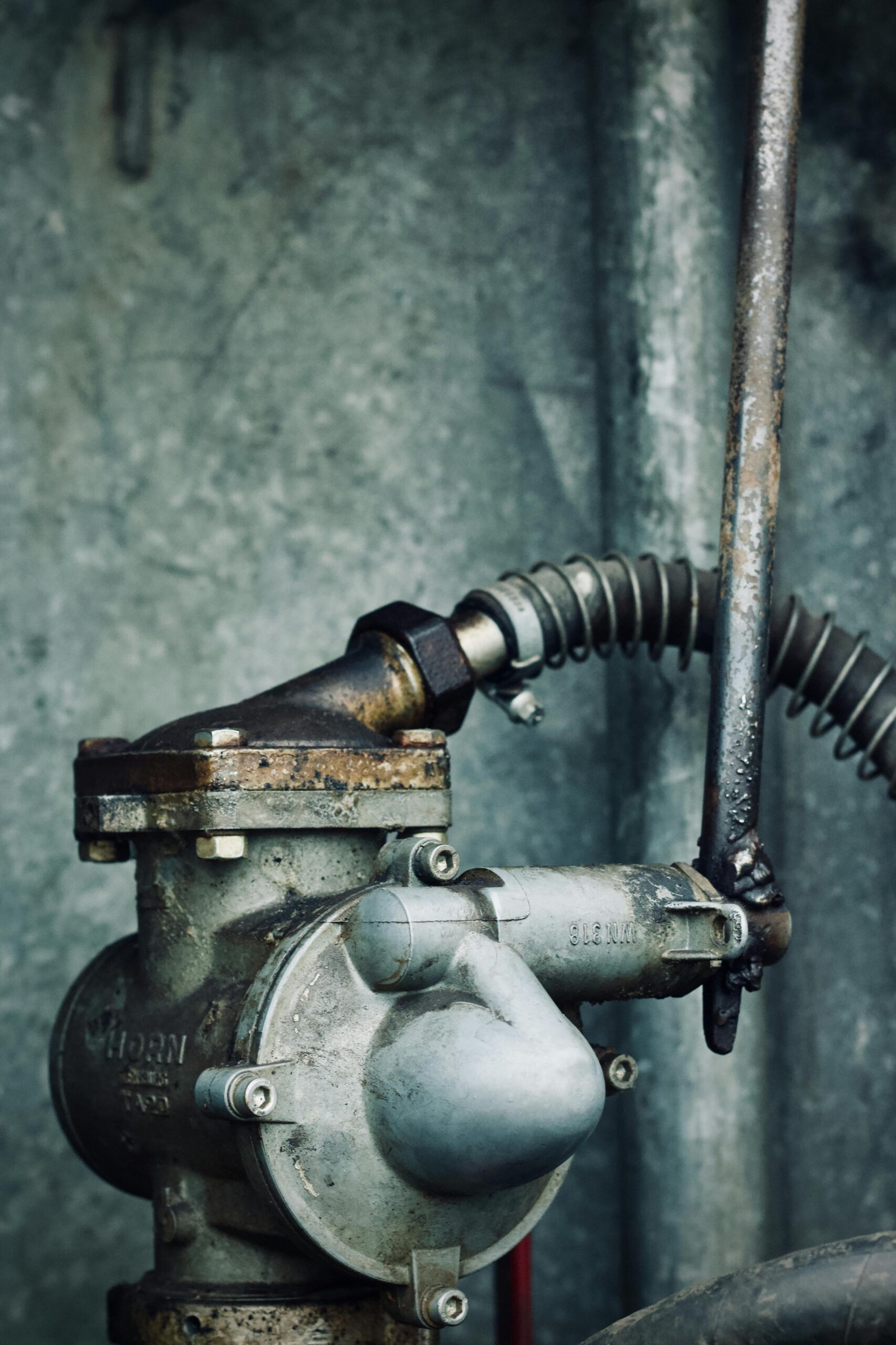 Industrial pump assembly with metal piping and valve controls in a mechanical system.